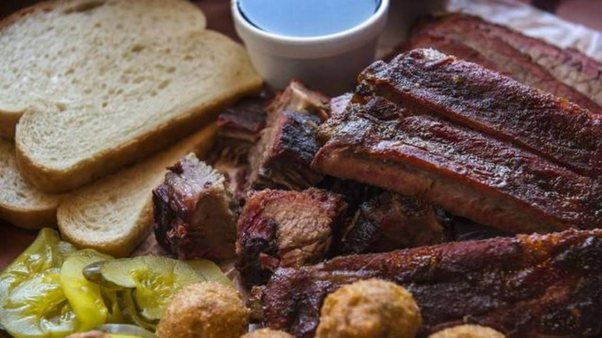 Slap’s combination plate of burnt ends, ribs and brisket, with a side of hush puppies.