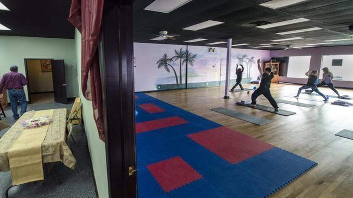 
Repartee Coffee and Pose Yoga share a space in the Metcalf 103 Shops in Overland Park. Sarah Goodman, leading the class, opened the yoga studio last year and recently added the coffee shop.

 
