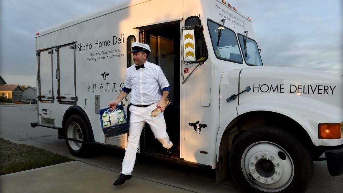 For an early morning delivery, business owner Matt Shatto dressed for the role of milkman.