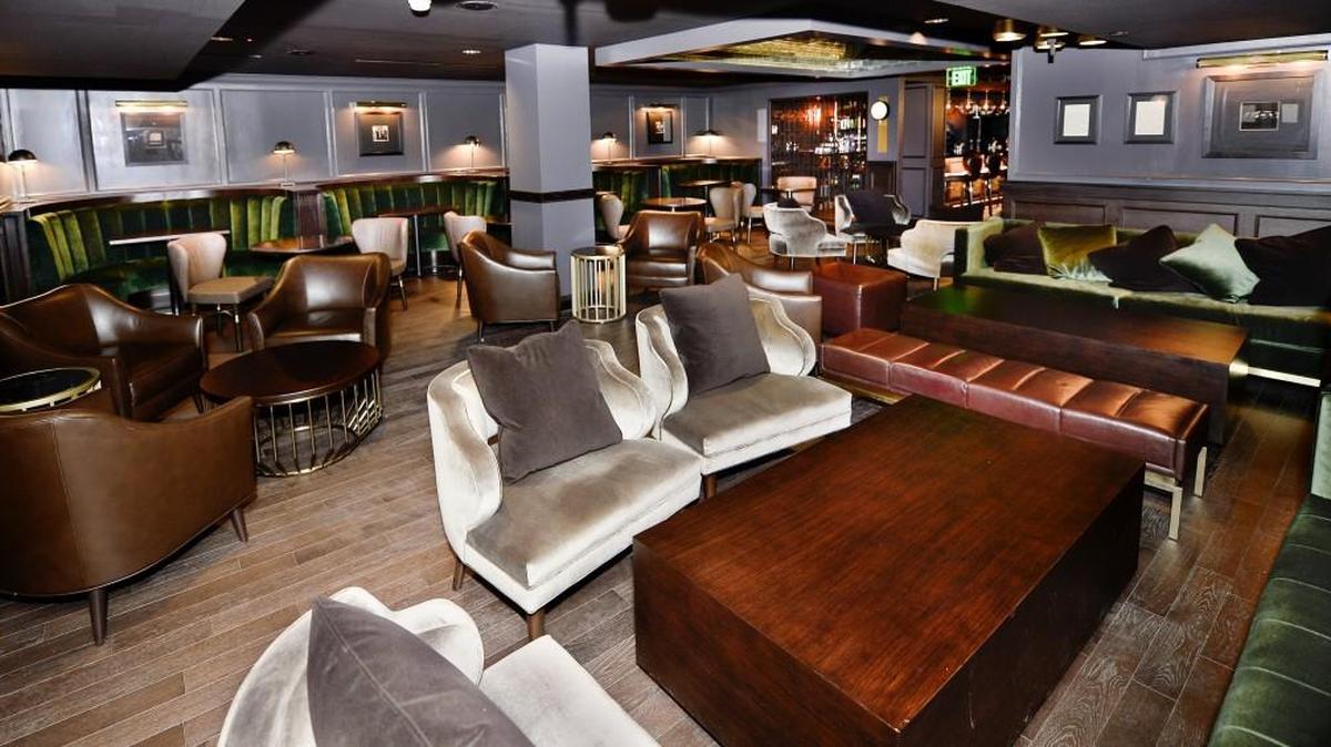 P.S. Speakeasy provides a glimpse into the past by maintaining the architectural significance of the building while providing new amenities for guests. Vintage pictures on the wall depict Prohibition days, and a cabinet in the bar area will be used to store liquor for regular customers.