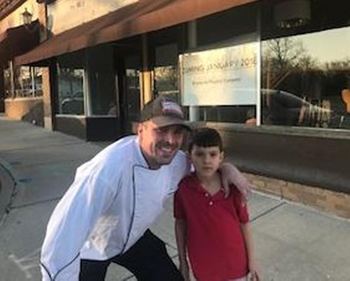 Chef Charles d’Ablaing and his son, Philipe, 5, in front on the new Brookside Poultry Co.