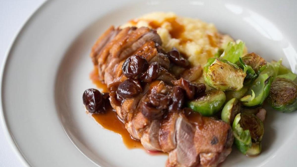Lidia’s Anitra — seared duck breast, polenta, Brussels sprouts with pancetta and grappa soaked cherry sauce.