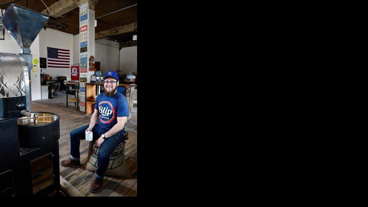 
Ian Davis is co-owner and operator of Blip Roasters in the West Bottoms. The coffee roasting company has a motorcycle theme and offers a clothing line. The roaster is at left. 
