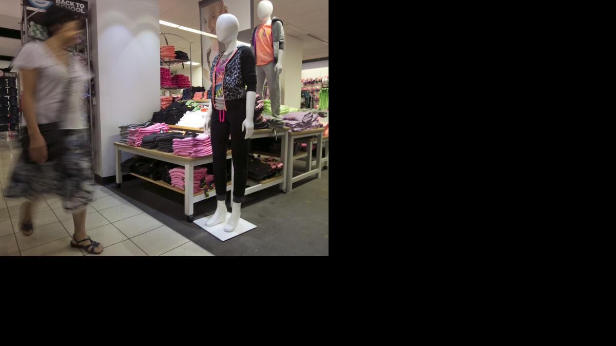 
A woman passes an active wear display at a J.C. Penney store, in New York. 
