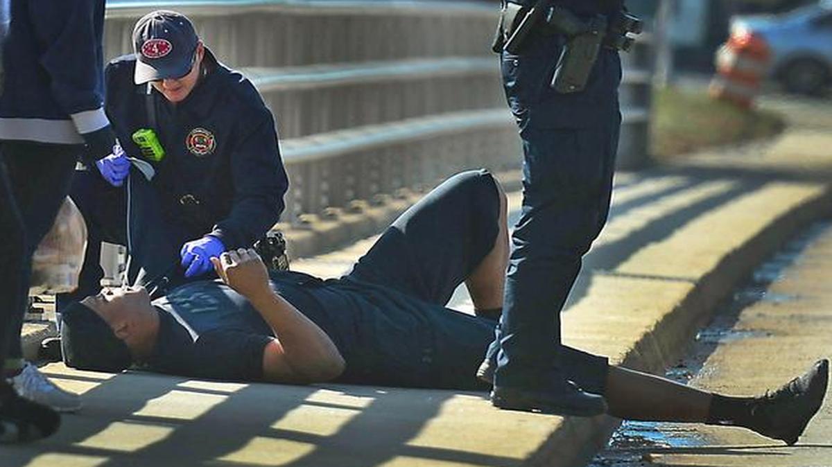 
A Charlotte firefighter tends to Carolina Panthers NFL football quarterback Cam Newton following a two-vehicle crash
