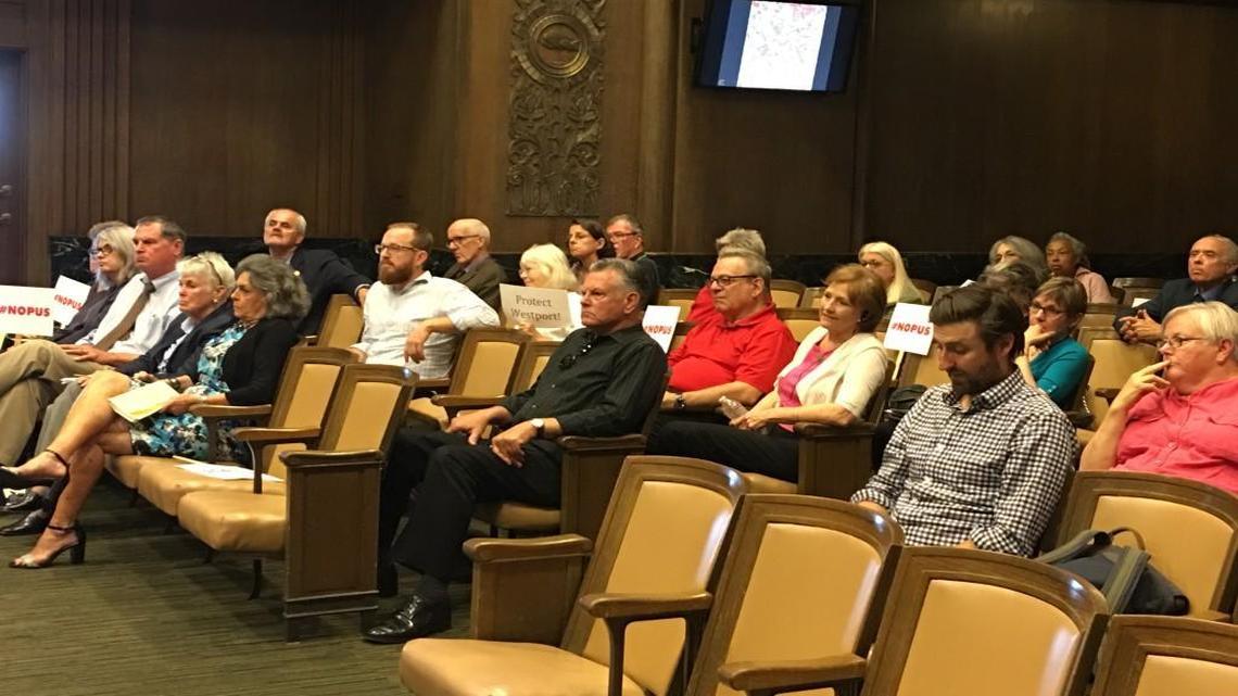 Some Kansas Citians who testified against a proposed apartment complex at Westport Road and Broadway came to the City Plan Commission meeting Tuesday with signs indicating disapproval of the plan.