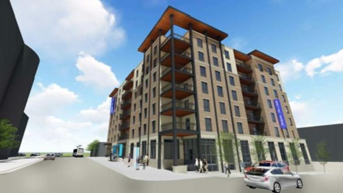 An artistic rendering shows a proposed 132-room Hampton Inn & Suites at the northeast corner of 16th and Main streets.