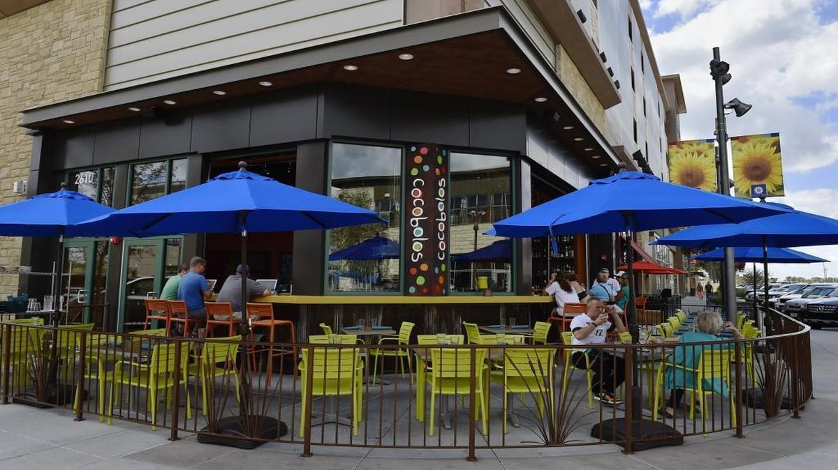 The Prairiefire development, which includes the restaurant Cocobolos, didn’t make enough sales to cover interest payments.