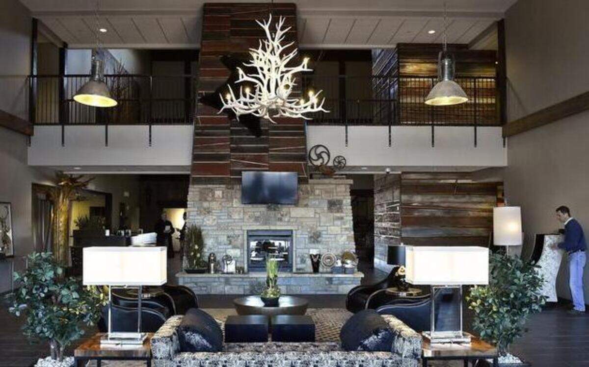 
The new Stoney Creek Hotel and Conference Center in the Falls at Crackerneck Creek development, the site of Bass Pro in Independence, opened Sunday. Officials hope the project will mean new momentum for the development, which opened about the time the recession hit. Here is the “living room” part of the lobby, which offers a view of a lake.
