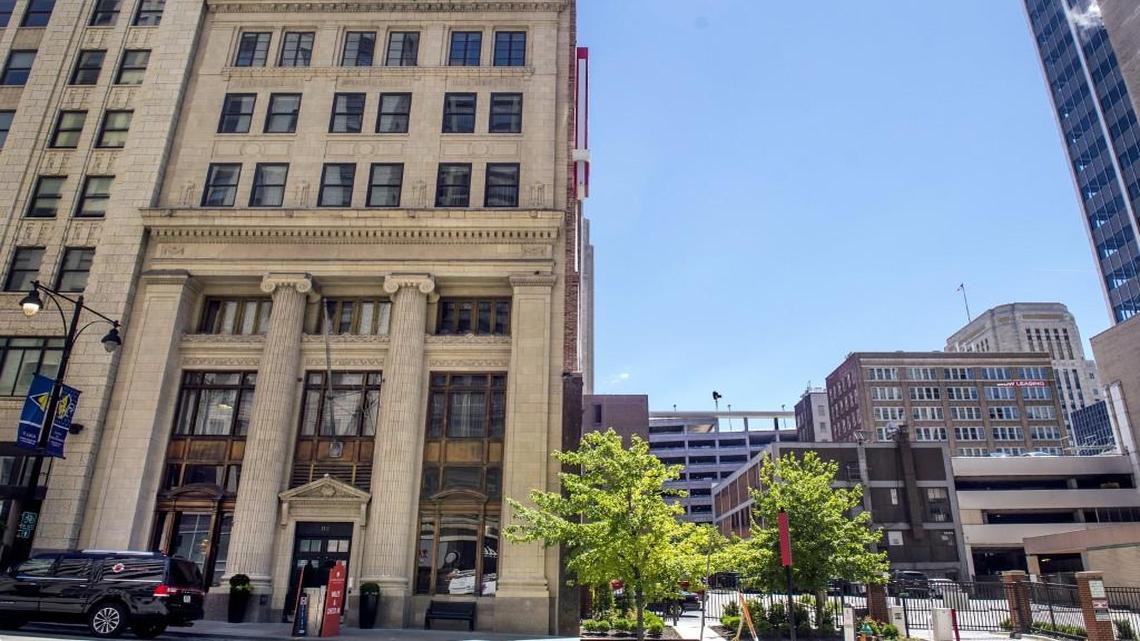 The Ambassador Hotel (left) pictured on Tuesday at 1111 Grand Blvd. in downtown Kansas City, is asking to create a Community Improvement District to help finance expansion of the hotel atop its adjacent parking lot.