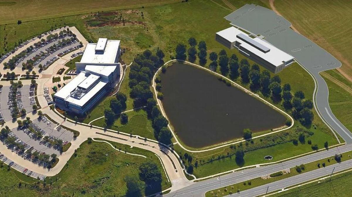 A depiction of where Terracon will build its headquarters to the right, across a pond from an existing John Deere building on the left