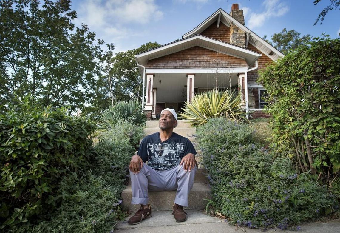 George Allen, 63, watches as construction trucks roll through his Beacon Hill neighborhood near 26th Street and Tracy Avenue. Allen’s home, which dates to 1900 and has been in his family for three generations, has declined offers to purchase his property and an adjoining lot he owns. The neighborhood, just a few minutes from East Crossroads and downtown, is seeing a building boom of high-end homes.