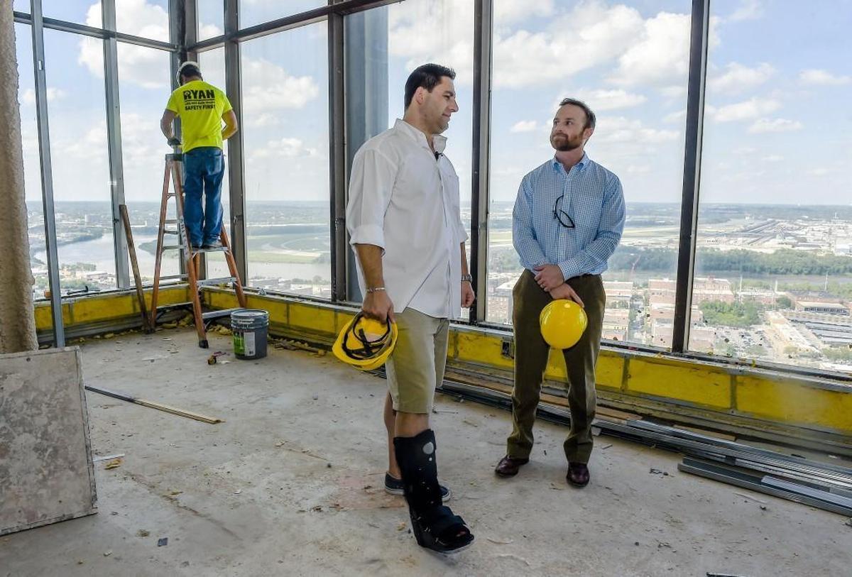 In this 2016 file photo, Michael Knight (center) surveyed one of the penthouses with a view of downtown Kansas City.