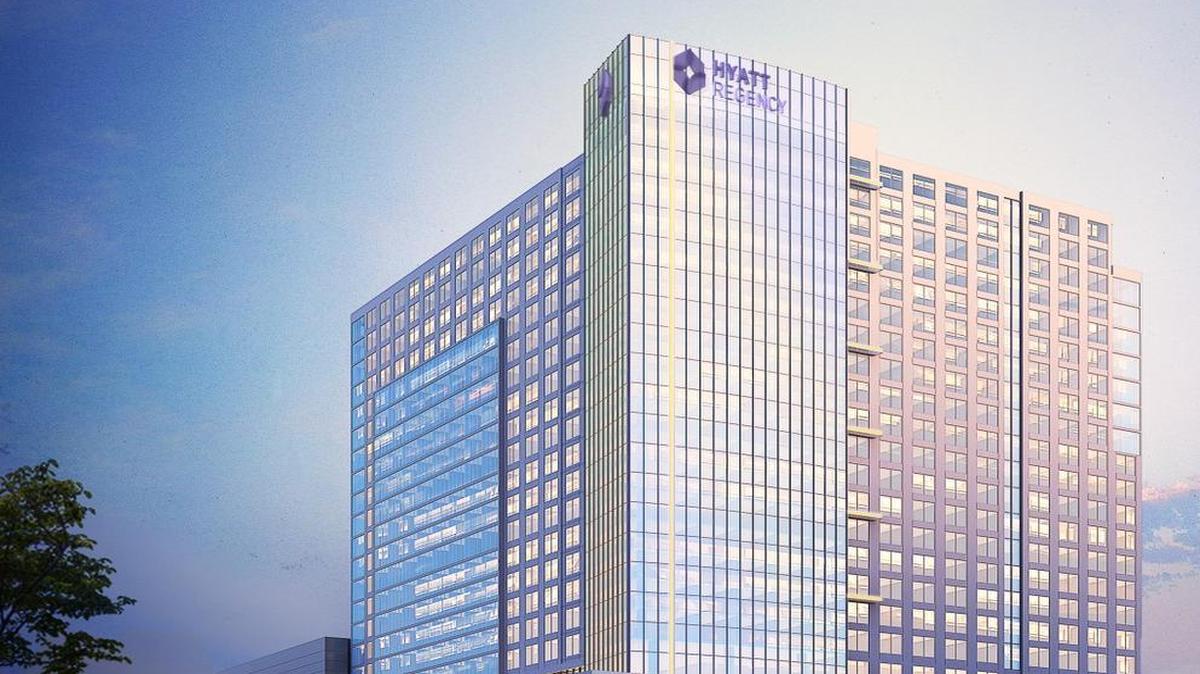 A revised rendering shows the proposed downtown convention hotel. The developers have obtained a construction loan for the project.