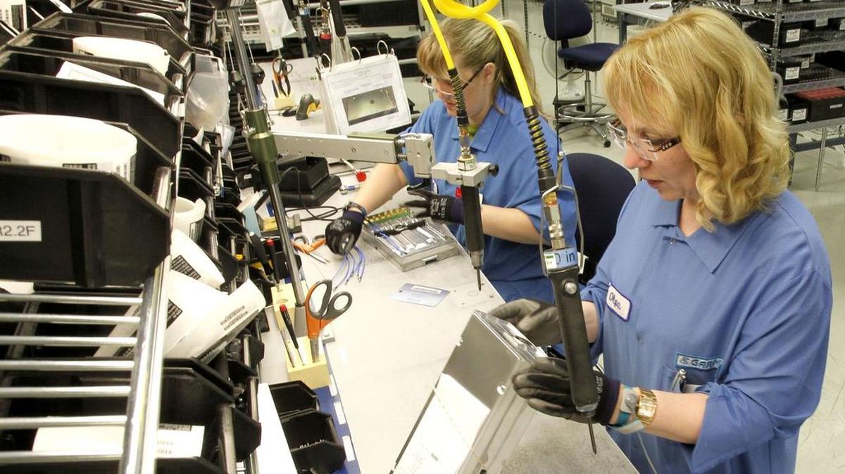 Garmin electronics assemblers put together aviation traffic systems Friday at the Olathe manufacturing plant and headquarters, 1200 E. 151st