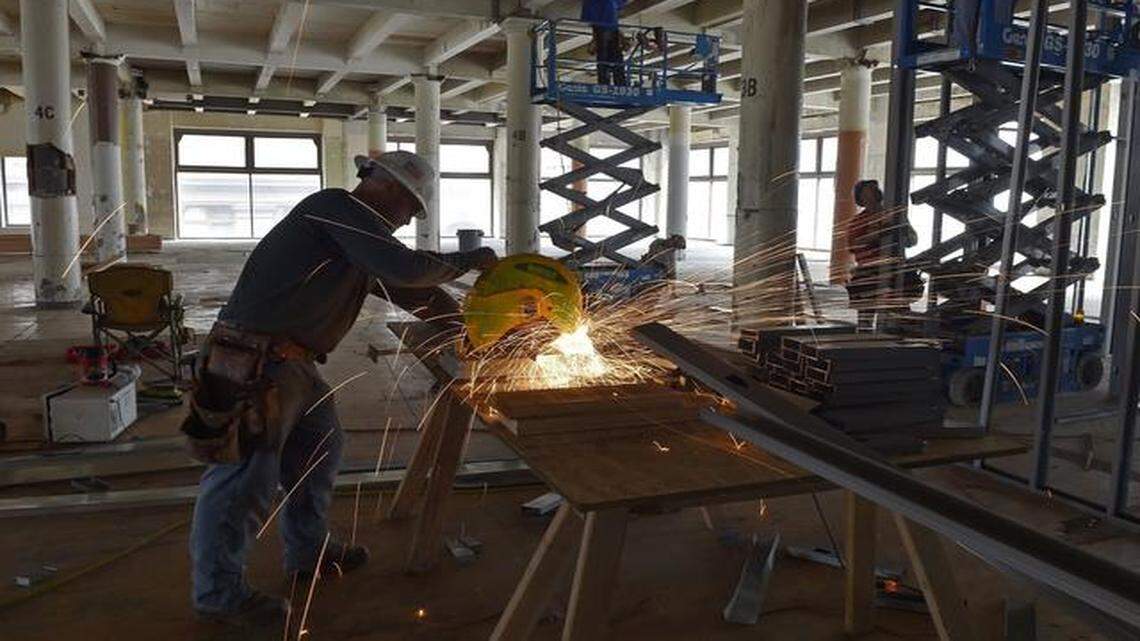 
Chad Nash of Green Field Energy Group Inc. cuts metal studs that were being installed on the fifth floor of the Swofford building, formerly part of the Folgers plant in downtown Kansas City. The Swofford and Boss buildings are slated to become apartments under a historic preservation conversion. The property has undergone massive factory demolition and still is under major construction.
