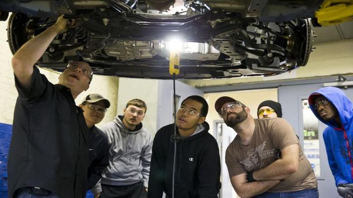 
Assistant Professor Dan Reed teaches automotive service technology students at the Community College of Philadelphia, in Philadelphia. 
