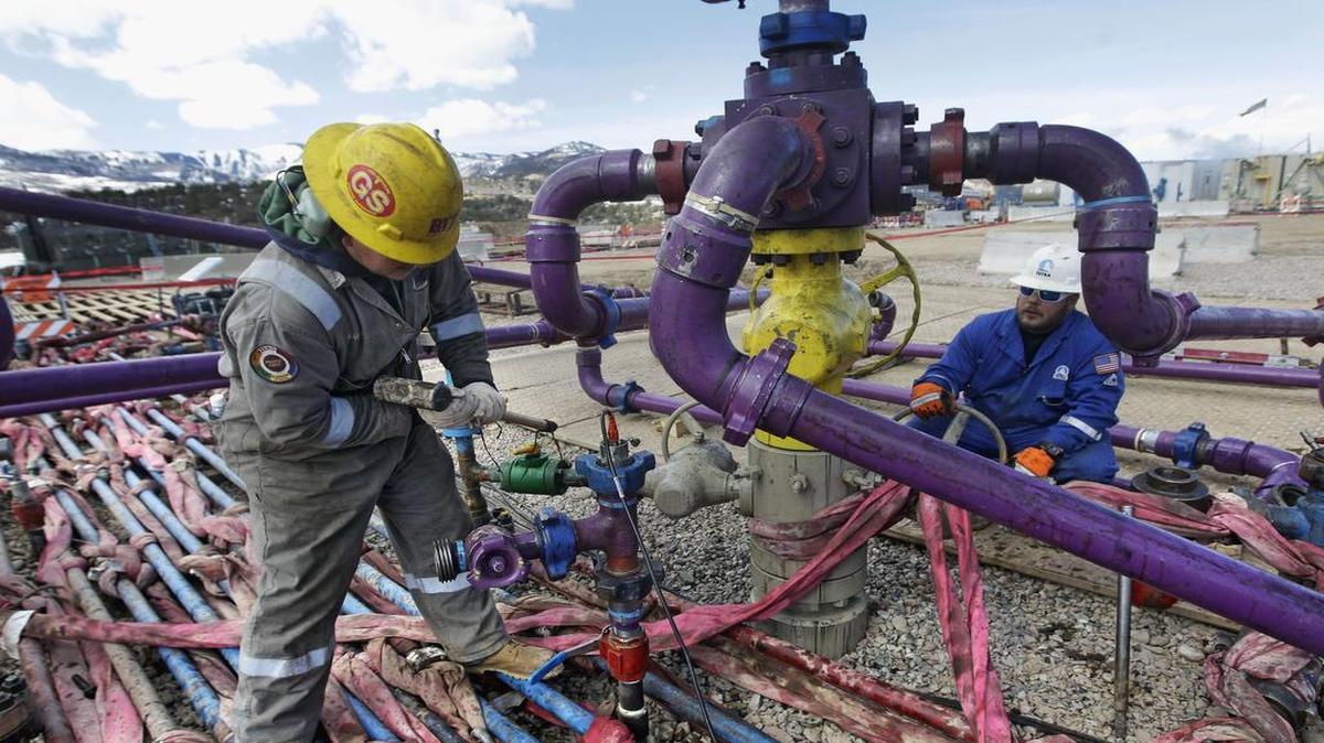 
Workers tended to a wellhead during a hydraulic fracturing operation outside Rifle, Colo. 
