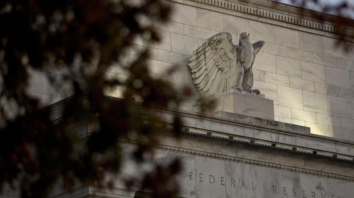 An eagle sculpture stands on the facade of the Marriner S. Eccles Federal Reserve building in Washington, D.C.