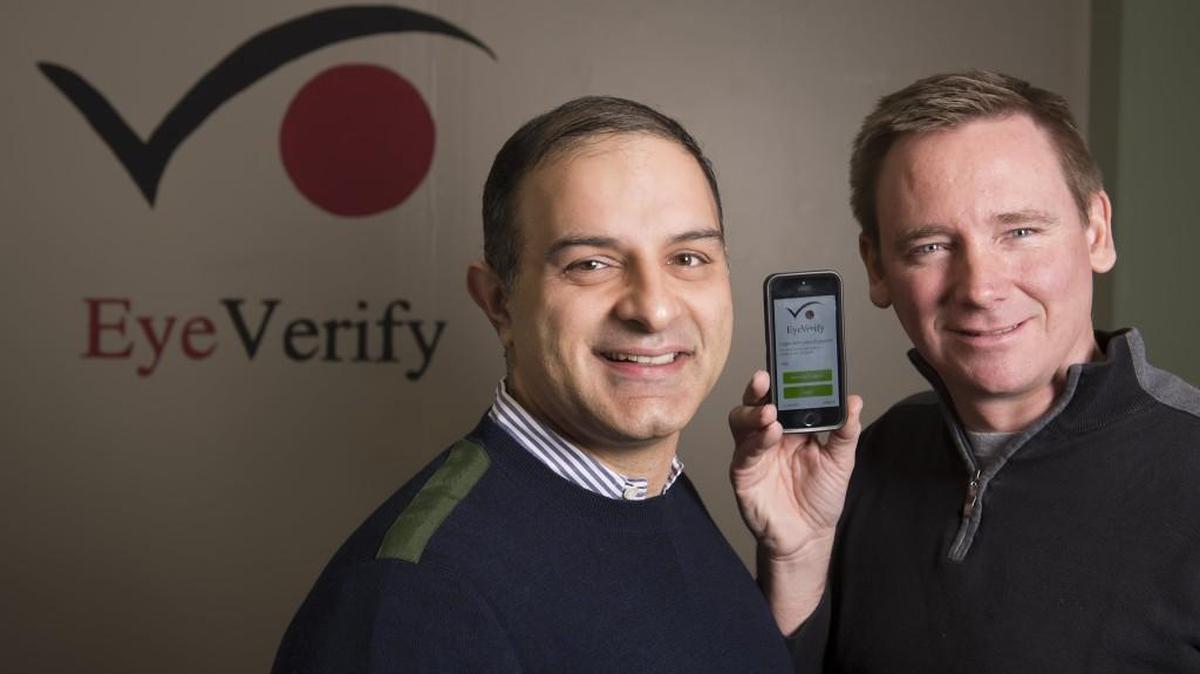 Reza Derakhshani, chief scientist, left, and Toby Rush, CEO and founder of EyeVerify, have invented and developed an eye scanning app that provides secure logins when matched with the phone owner's captured eye scans.