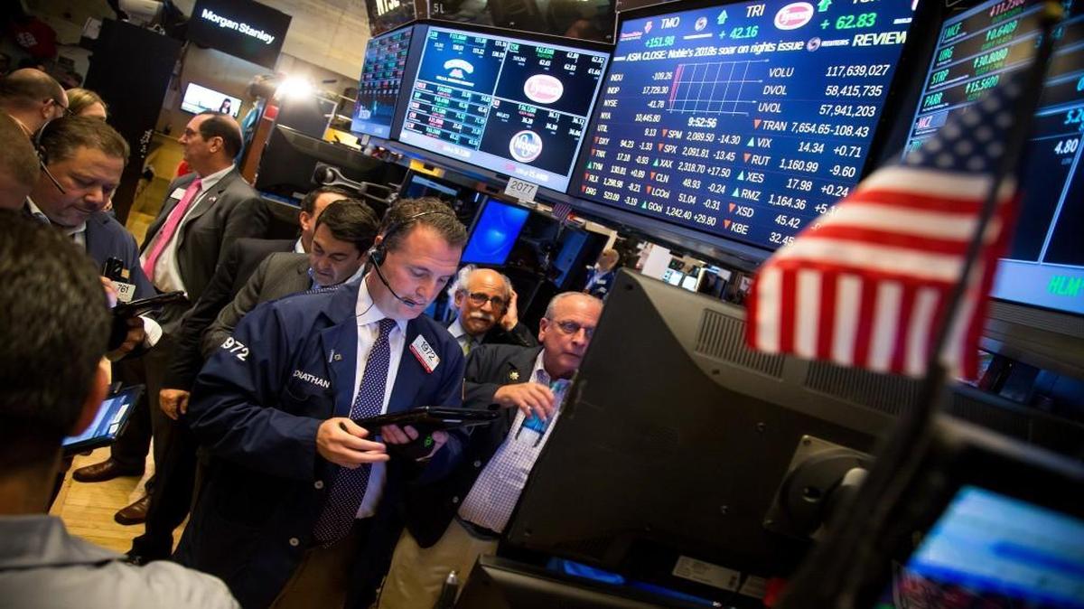 Traders worked Friday on the floor of the New York Stock Exchange.