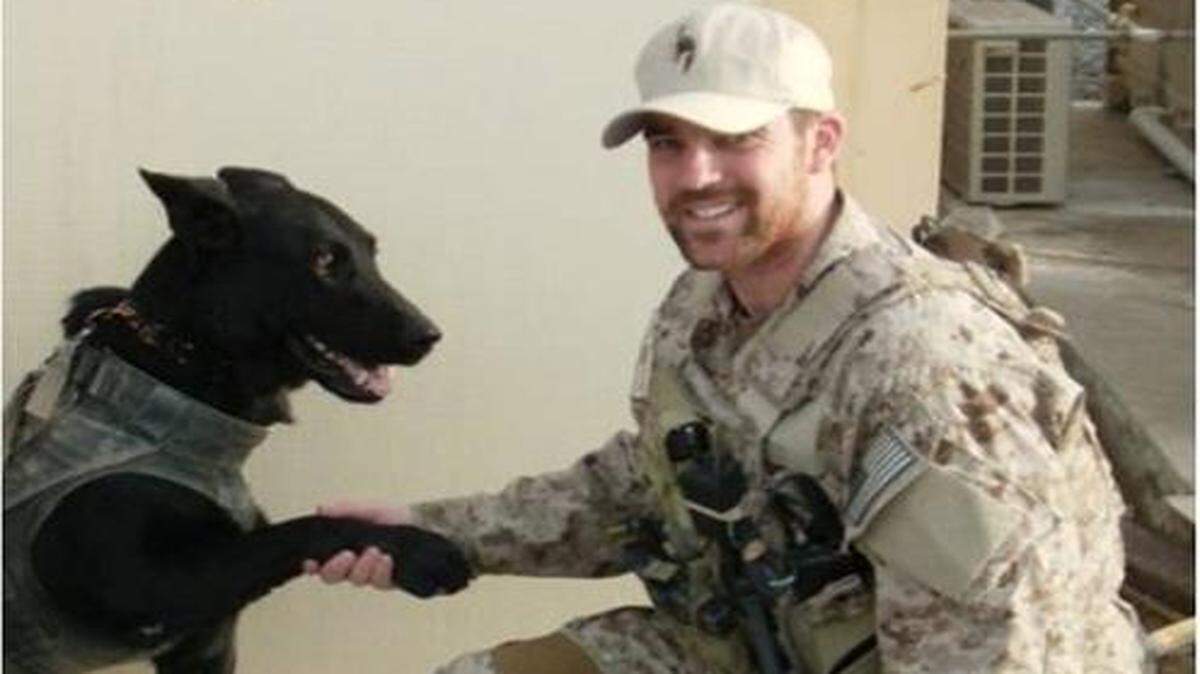 
Former Navy SEAL Sean McIntosh, shown in southern Afghanistan with a military working dog named Chopper, leads a new Kansas City incubator program for veterans who are starting up businesses.
