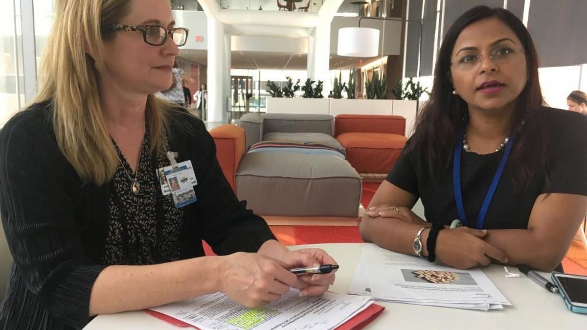 Rafia Rasu of the University of Kansas School of Pharmacy discusses the findings of years of research on opioid prescribing while her research partner, Maureen Knell of the University of Missouri-Kansas City, looks on.