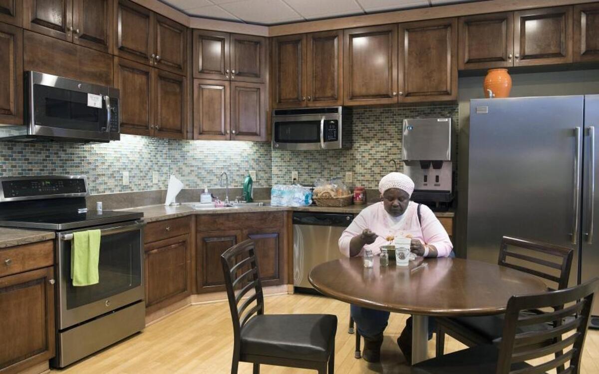 Regina Taylor of Sedalia, Mo., had a few moments to herself Monday to eat in the Ronald McDonald House Family Room at Children’s Mercy Hospital in Kansas City. Taylor was at the hospital to support her grand-niece, a patient. The family room, which was celebrating its 20th anniversary, provides parents and family members a private area just steps away from their child’s room where they can sleep, shower or prepare a meal. The family room at Children’s Mercy Hospital was the first in the entire Ronald McDonald House system, and now there are more than 200 such rooms across the world.