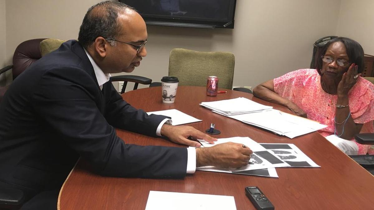 Nirmal Veeramachaneni, a thoracic surgeon at the University of Kansas Hospital, goes over Bettye Givens’ lung scans. Givens, from south Kansas City, had a low-dose CT scan that detected her lung cancer at its earliest stage and was successfully treated. Other smokers don’t have access to the test because not all doctors know about it and Medicare only covers it for health centers that meet stringent requirements.