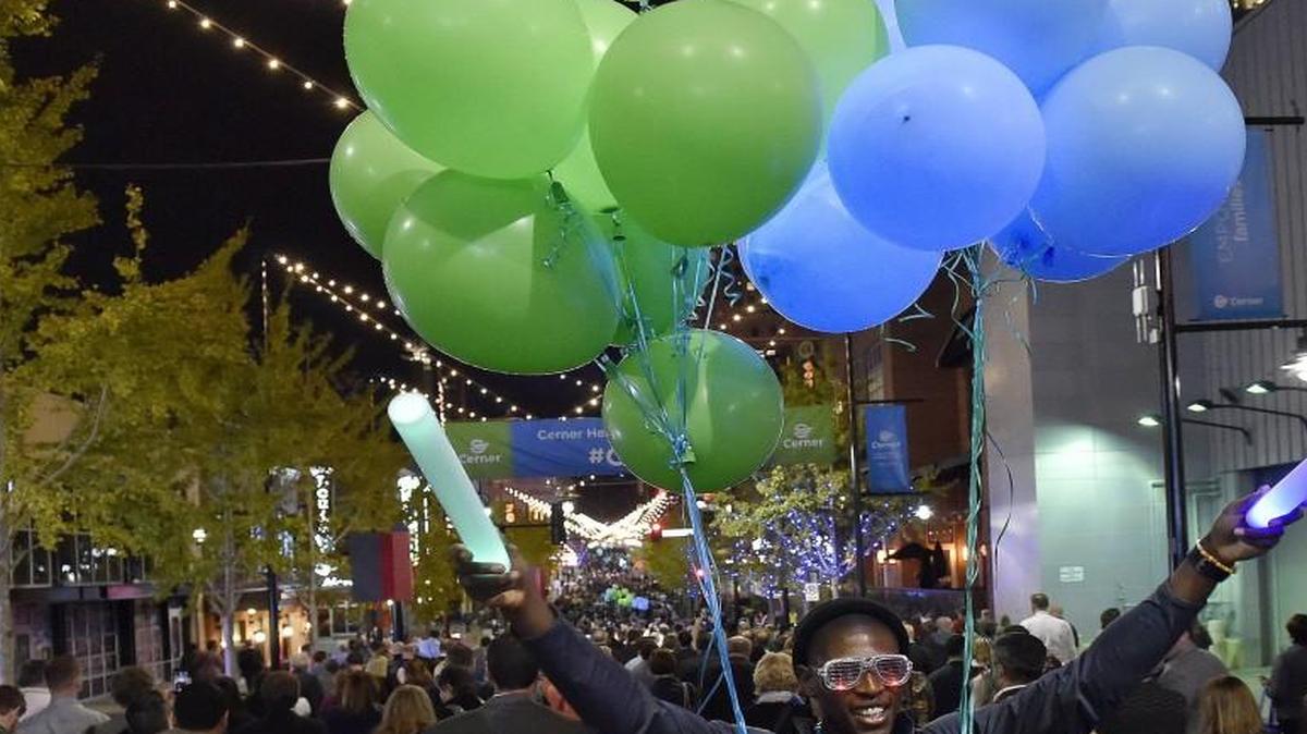 The 2016 Cerner Health Conference got underway Monday at the Sprint Center. The annual Cerner conference expects 15,000 attendees for various events this week downtown. Later Monday, the crowd walked from the Sprint Center to the Kansas City Convention Center for dinner. Helping guide them along 14th Street was Richard Eboka, a festively dressed Cerner consulting analyst.