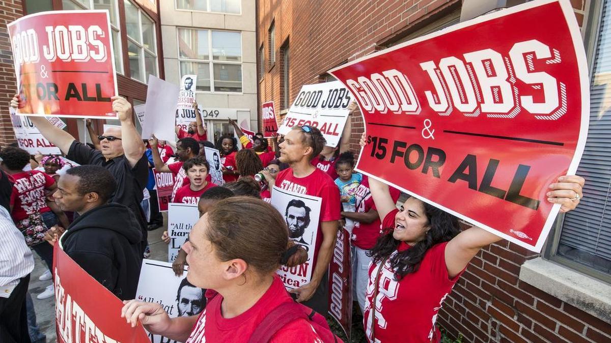 
Aude Negrete (right) called for a wage of $15 per hour Thursday in a rally by the Westport office of the Greater Kansas City Restaurant Association.

