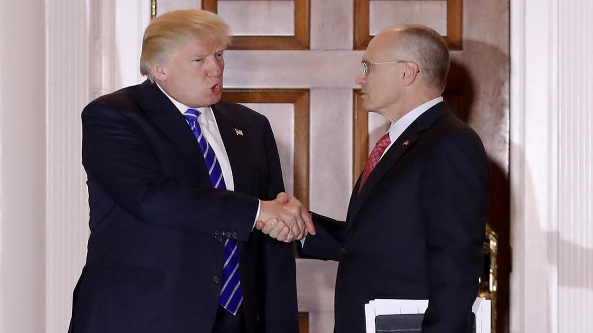 President-elect Donald Trump shook hands with Andy Puzder, the CEO of CKE Restaurants and his pick to head the Labor Department. Union members fear Puzder will enact policies unfriendly to the labor movement.