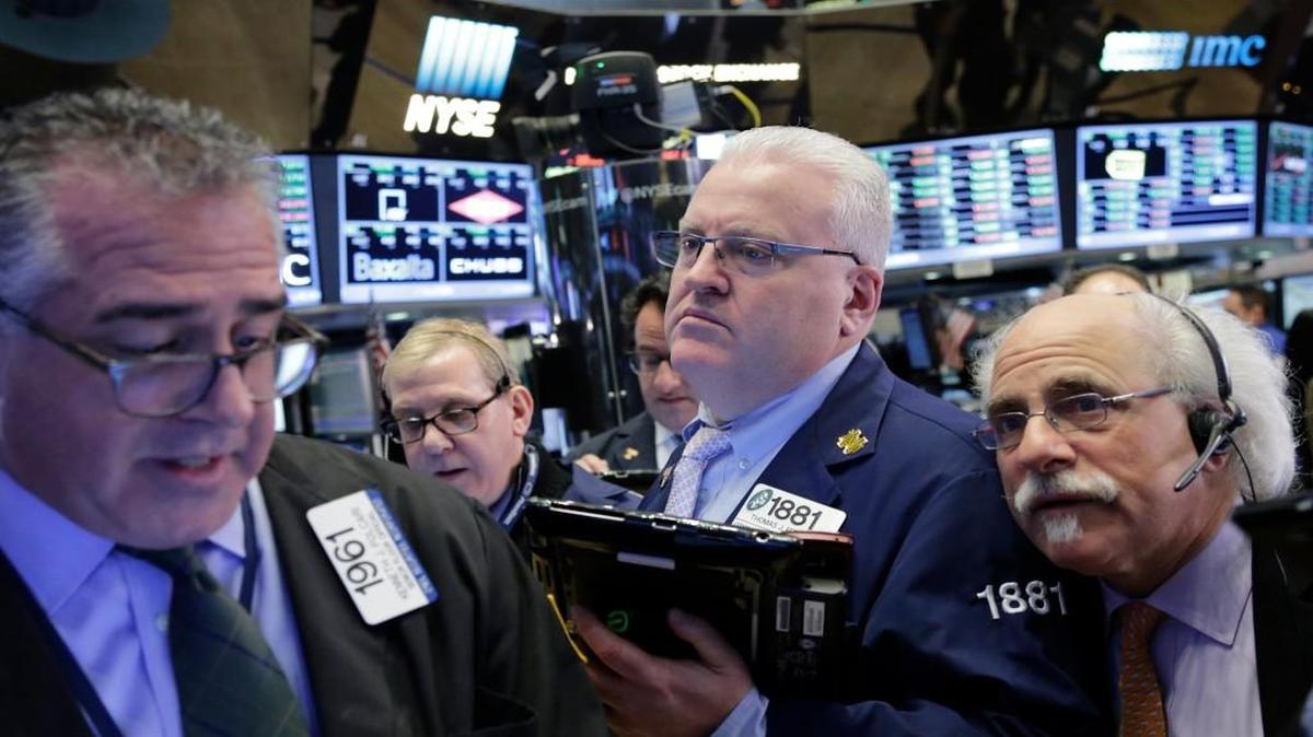 Traders worked the floor of the New York Stock Exchange on Friday.