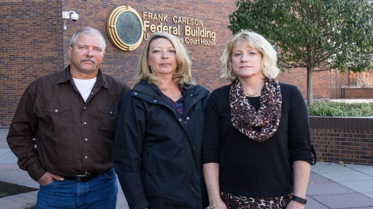 Prosecutors met with family members of Bartlett Grain blast victims, including Kevin (from left) and Zoe Bock, and Inga Klahr, at the Topeka Federal Building on Thursday to tell them that they will not pursue criminal charges against Bartlett Grain for the 2011 grain elevator explosion that killed six.