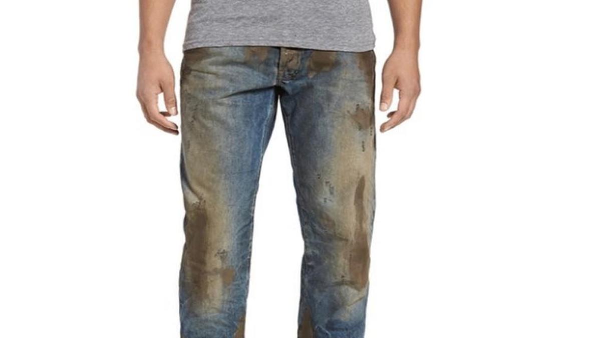 These $425 jeans distressed with fake mud have social media in a lather.