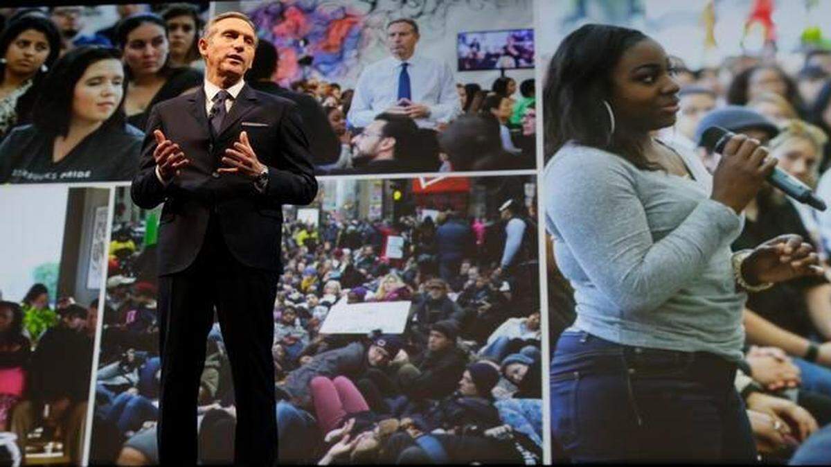 
At Starbucks’ annual shareholders meeting in Seattle, CEO Howard Schultz spoke Wednesday while photos of forums he has held across the country on the topic of race relations were projected behind him.
