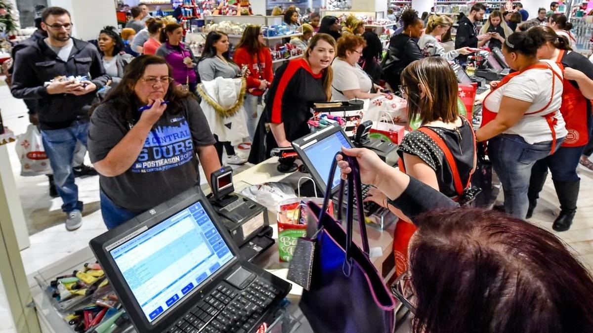 The checkouts were busy as large crowds shopped on Black Friday, Nov. 25, at Bath and Body Works at Independence Center. Holiday shoppers abandoned their early reluctance and boosted spending as the season wore on, pushing sales to the biggest increase in more than a decade, according to research firm Customer Growth Partners.