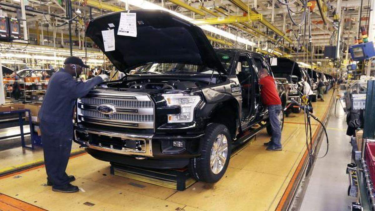 
A third shift of workers will be added to the Ford Claycomo plant by the end of the first quarter to build the 2015 F-150, which is all new and clad in an aluminum body. This Ford F-150 truck was being assembled in November at the Rouge Truck Plant in Dearborn, Mich.
