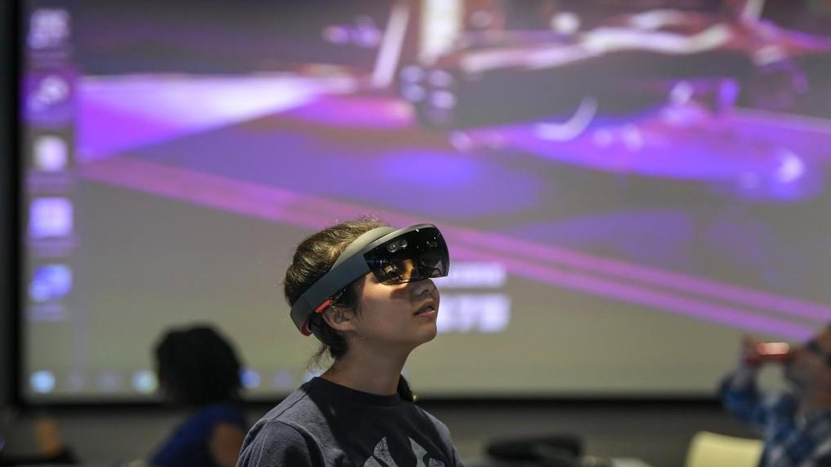 Niko Cano, 13, of Overland Park, wore an augmented reality headset during Saturday’s Hackathon hosted by KCVR at the Google Fiber Space at 1814 Westport Road, for developers to create programs to assist educators.