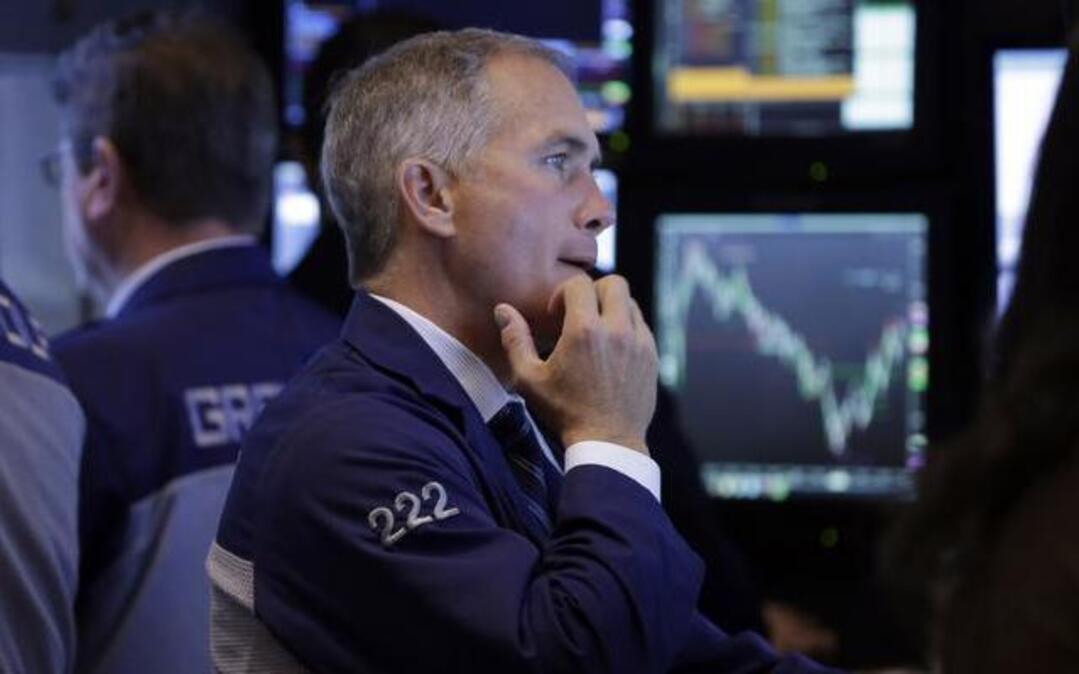 
Timothy Nick worked the floor of the New York Stock Exchange on Wednesday. The chart behind him showed the day’s ups and downs. The Dow and other indexes have given up their gains of recent months. 
