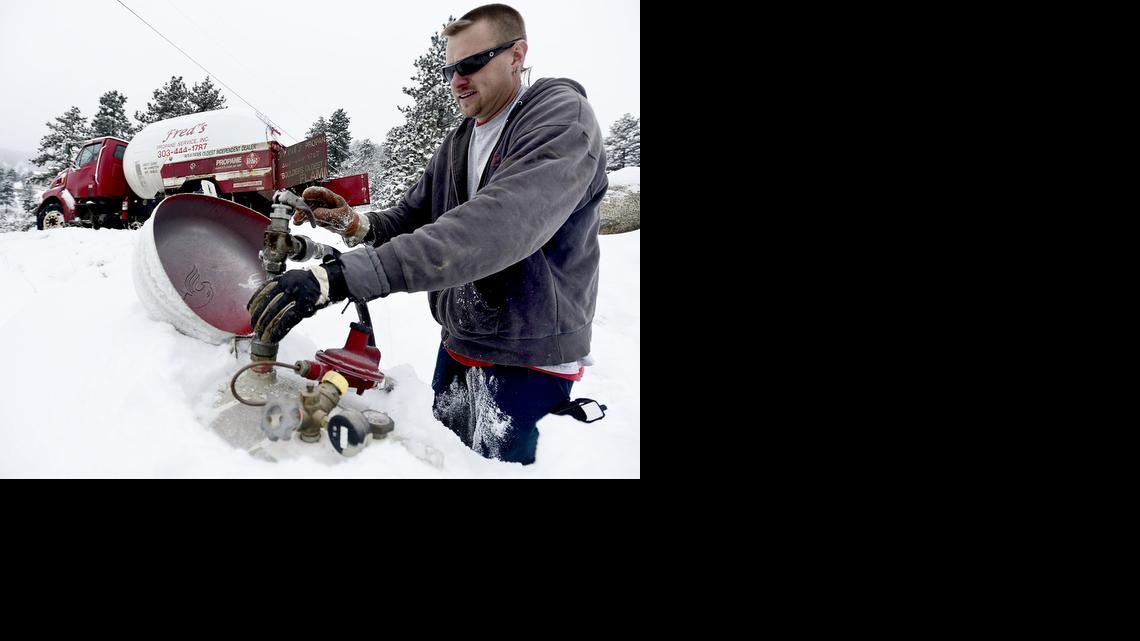 
Harsh weather contributed to a propane supply crisis last winter. In January, Jasen Wise, with Fred’s Propane Service, filled a tank for a customer in Boulder, Colo.
