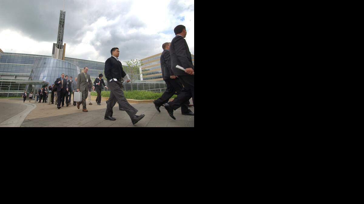 
Newly hired Cerner employees tour the Cerner campus during an orientation session.
