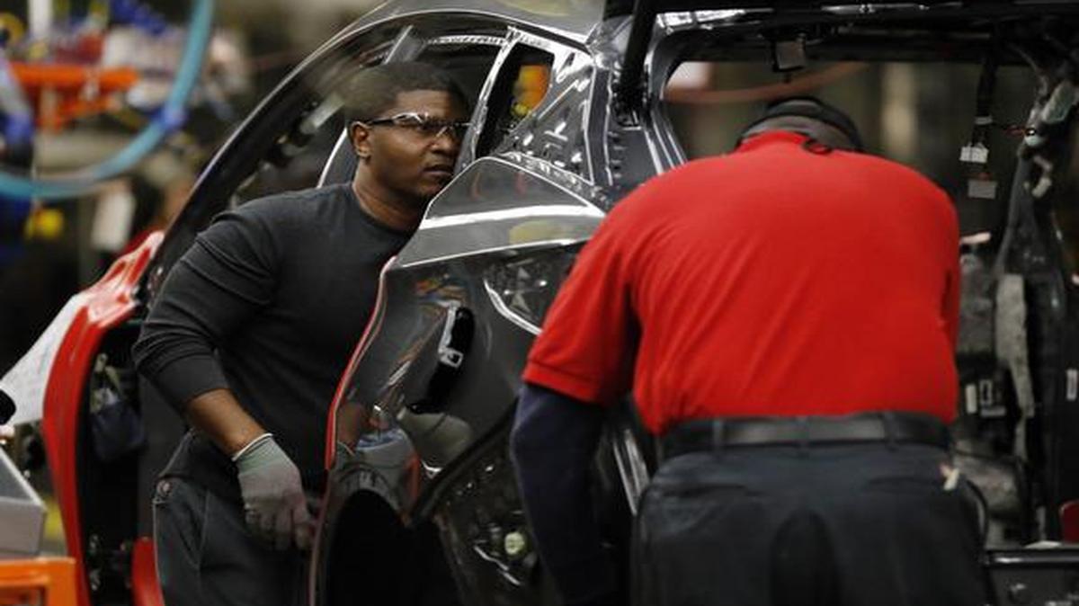 
Nissan trim and chassis workers work on a new 2015 Nissan Murano at the Nissan plant in Canton, Miss.
