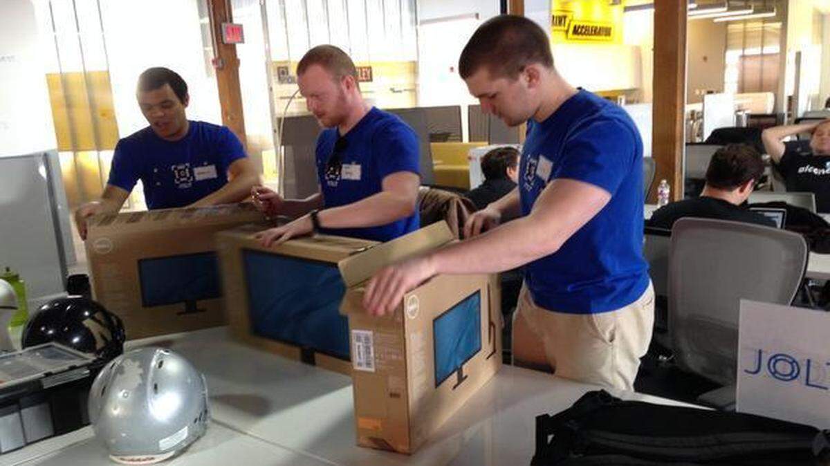 
Team members of Jolt, a startup business at the Sprint Mobile Health Accelerator, unpacked computers on their first day in the three-month program.
