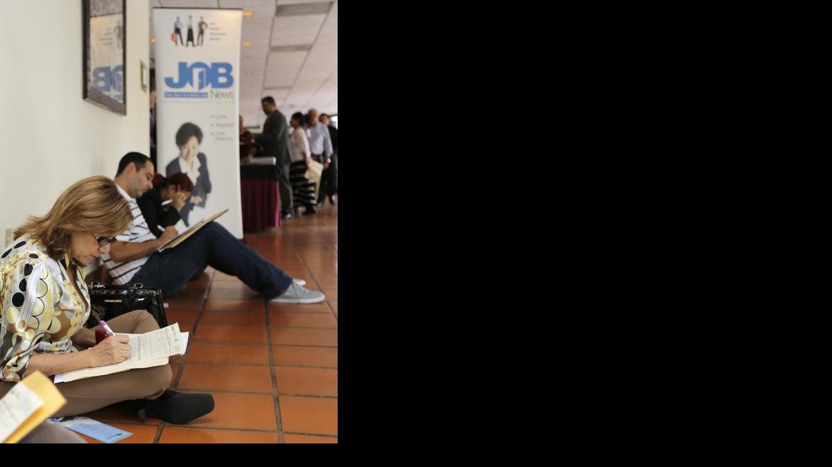 
Job seekers filled out applications at a job fair in Miami Lakes, Fla.
