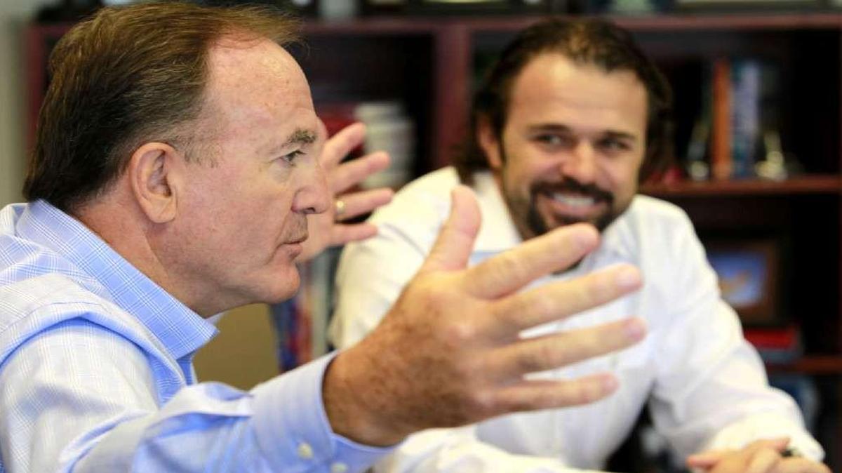 YRC Worldwide CEO James Welch (left) makes a point as finance chief Jamie Pierson looks on. Pierson is resigning to take a similar post with a company in the Dallas area where he lives.