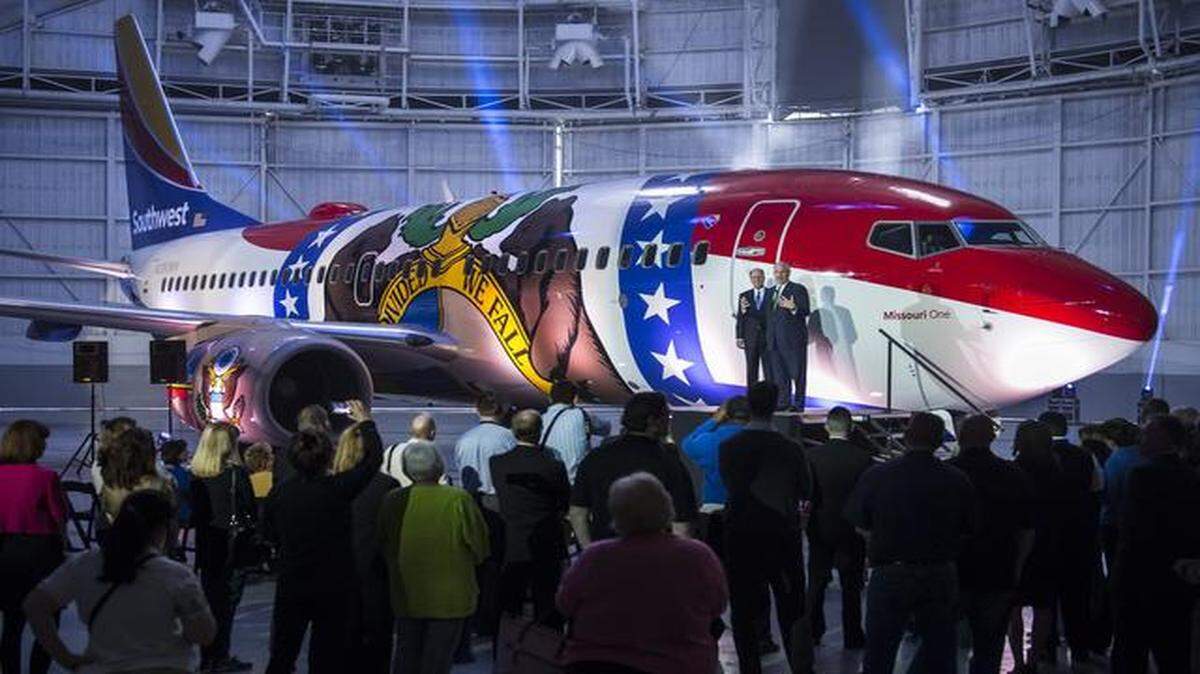 Southwest Airlines CEO Gary Kelly (left) and Missouri Gov. Jay Nixon unveiled the “Missouri One” Boeing 737, painted to look as if it had been draped in the Missouri flag. Southwest also announced a $5,000 gift to Union Station’s Science City Summer Camp.