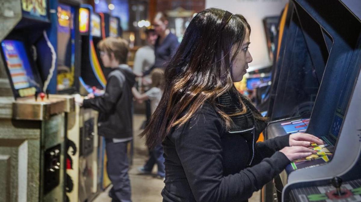 Abby Dimalanta played an arcade game earlier this year at Screenland Crossroads in Kansas City's Crossroads district.