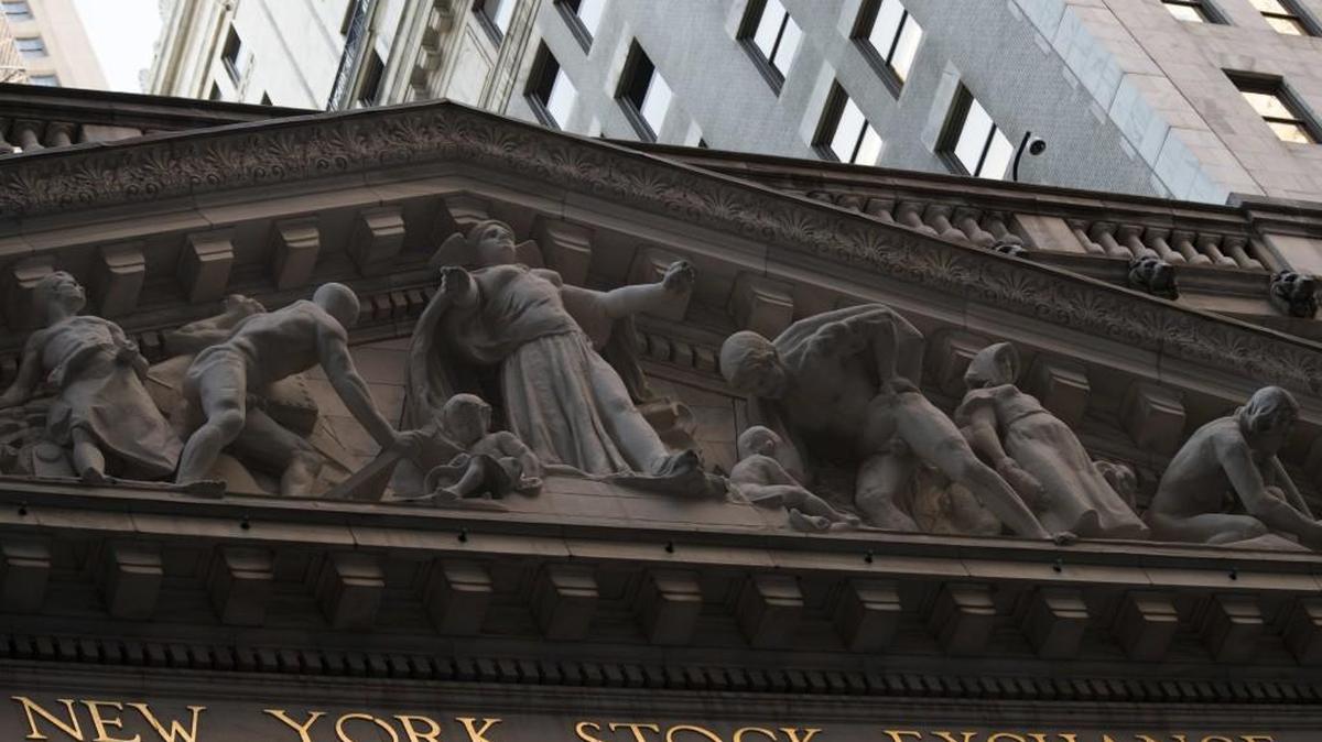 The New York Stock Exchange at sunset, in lower Manhattan. The Dow Jones Industrial Average was first published in 1896. The original index included 12 stocks. The calculation method is simple and can be done by hand – since that’s how it had to be done in 1896! The Dow has grown to 30 stocks and the companies making up the index are now chosen by the editorial board of the Wall Street Journal.