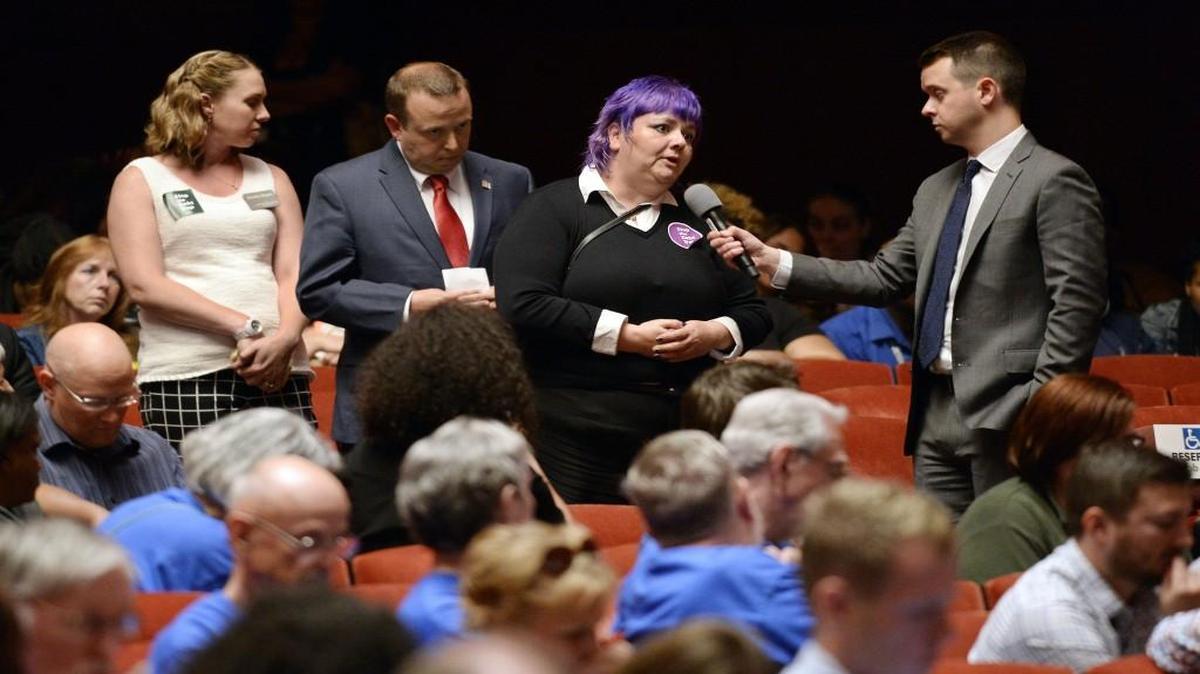 Amy Keaton (second from right) of Spring Hill, Kan., told a Consumer Financial Protection Bureau panel June 2 in the Music Hall that she has struggled after taking out a $200 payday loan a year ago. Keaton is getting the loan paid off with the help of Catholic Charities.